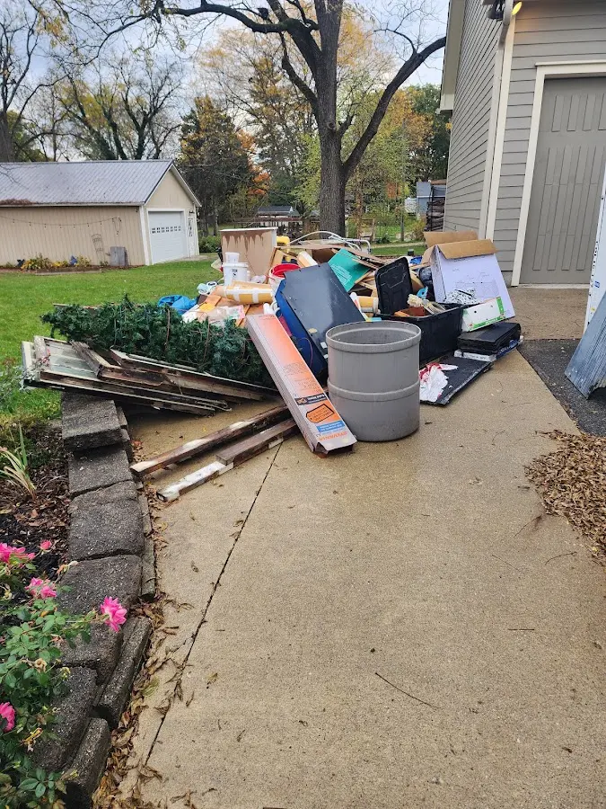 Dumpster being loaded with debris for Demolition Dumpster Rental in The Village